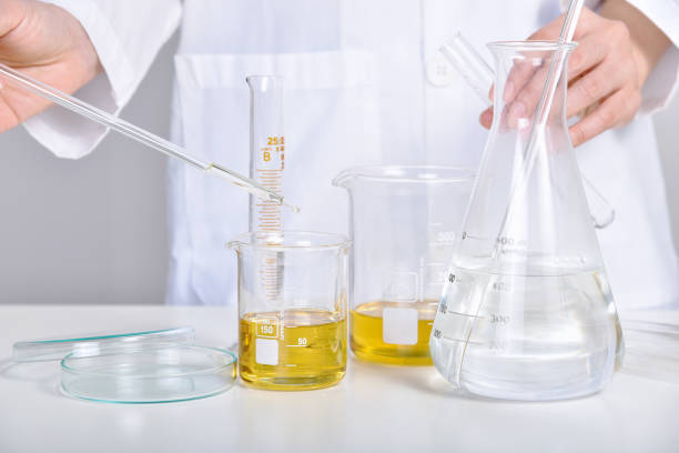 istock Oil dropping, Chemical reagent mixing, Laboratory and science experiments, Formulating the chemical for medical research, Quality control of petroleum industry products concept. 1393503713