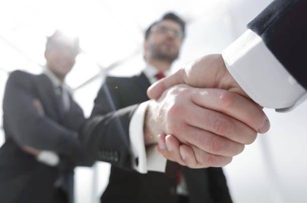 istock business background.business handshake 1393505970