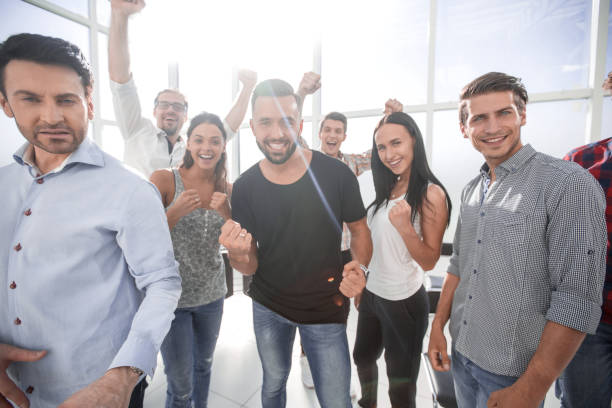 istock close up.a group of successful young people standing in the office 1393507151