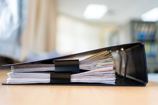 documents achieves paper files for searching information on work desk home office