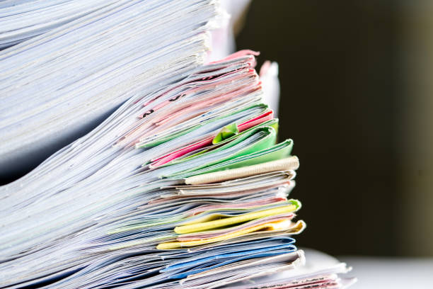 istock documents achieves paper files for searching information on work desk home office 1393508044