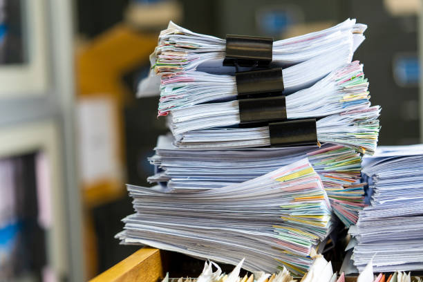 istock documents achieves paper files for searching information on work desk home office 1393508045