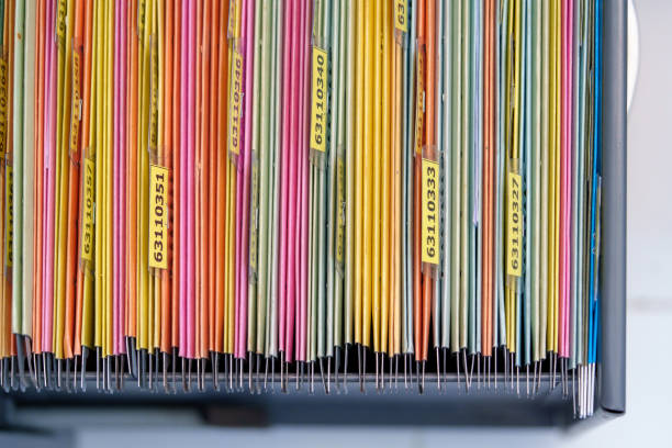 istock documents achieves paper files for searching information on work desk home office 1393508050