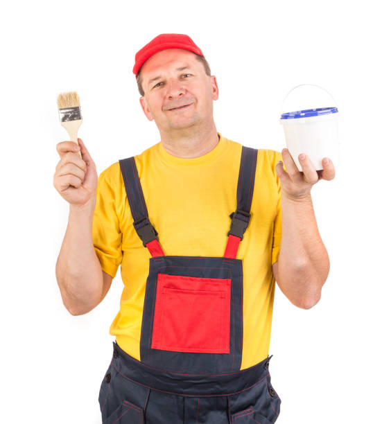 istock Worker with paint bucket and brush. 1393508314