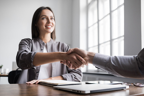 Handshake in office. Business etiquette, congratulation, meeting, job interview, new business, startup, employee, teamwork, trust concepts