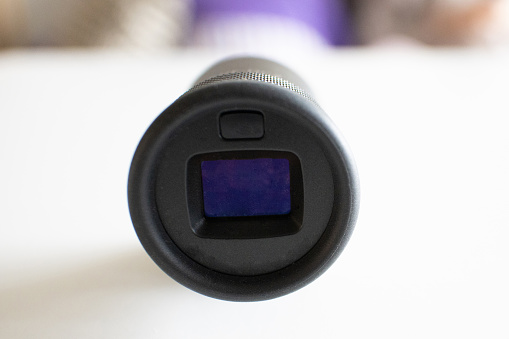 Close up of an external optical viewfinder that attaches to the digital camera via the hot shoe.