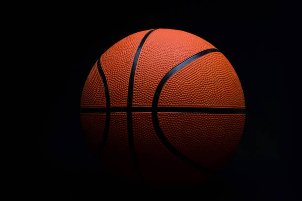 istock basketball on a black background 1393521393