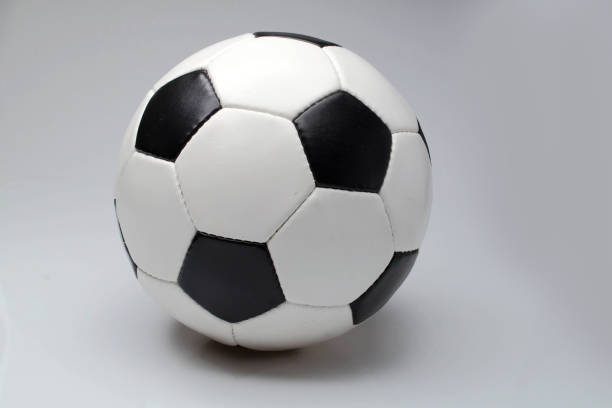 istock soccer ball on a black background 1393521915