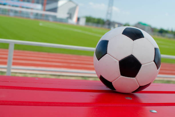 istock soccer ball on stadium 1393522553