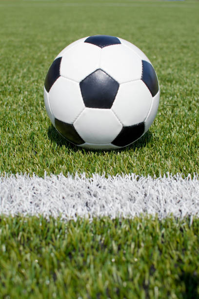 istock soccer ball on the green field 1393522629
