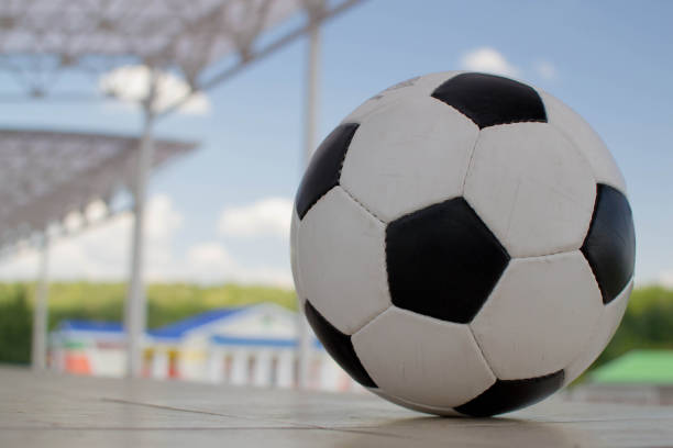 istock soccer ball on stadium 1393522875