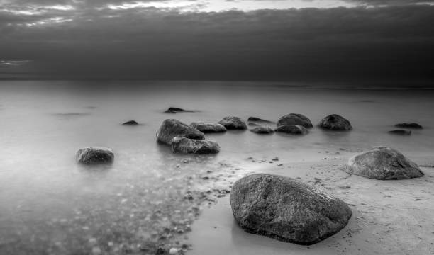 istock Stones on the beach. Black and white photography. 1393526870