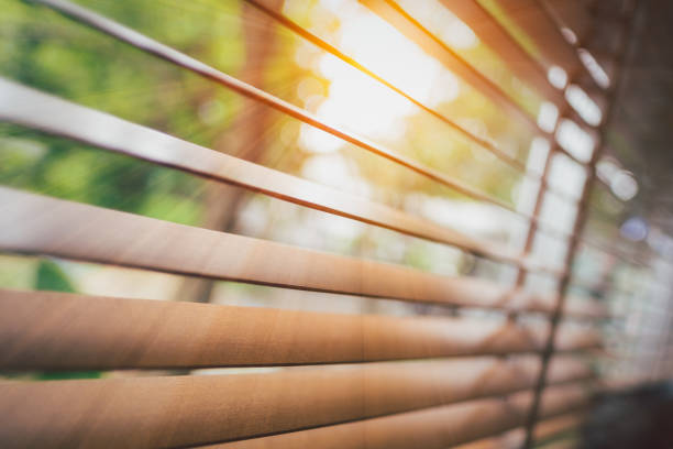 istock Wooden blinds with sun rays. 1393534983