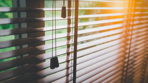 istock Wooden blinds with sun light. 1393534984