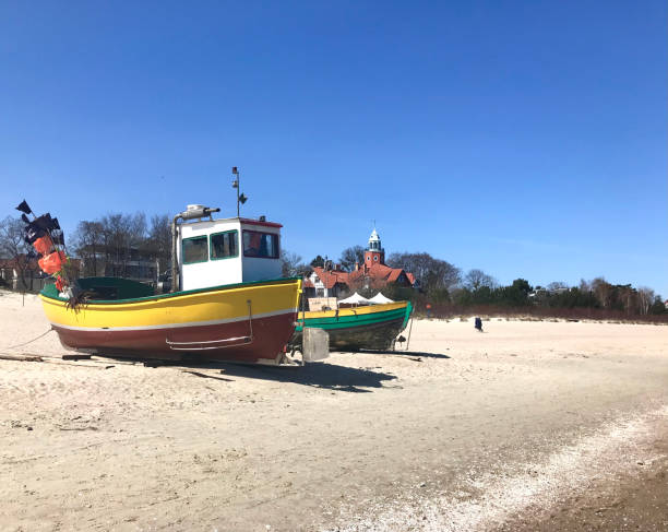 istock fishing boat on the beach 1393537451
