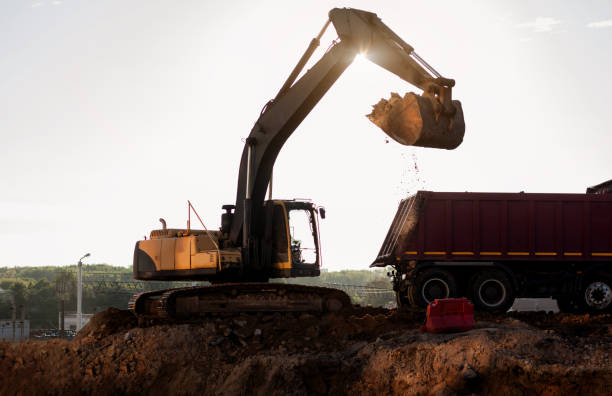 istock Excavation and loading onto dump trucks with excavators. 1393539469