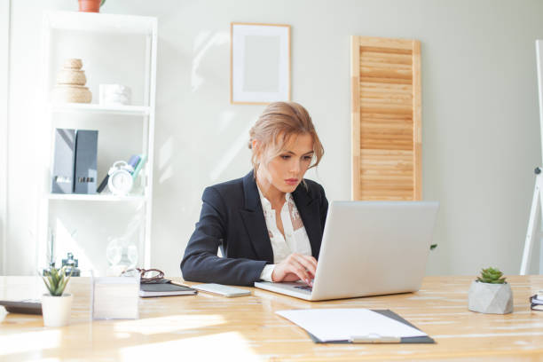 istock Smart businesswoman using laptop in the workspace 1393541978