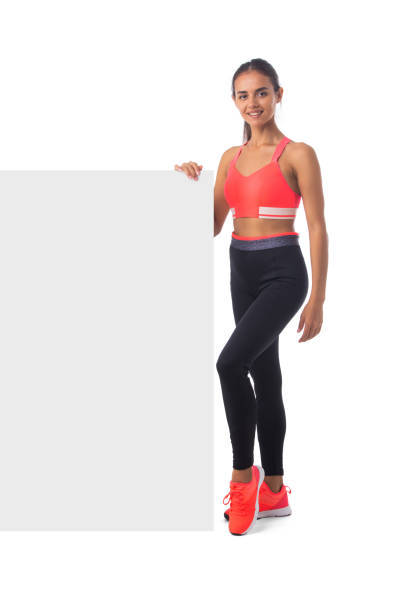 istock Sportswoman holding blank board 1393546416
