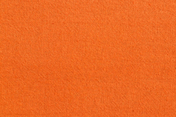 istock Orange cotton fabric texture background, seamless pattern of natural textile. 1393546486