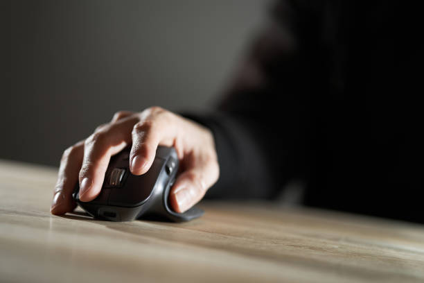 istock Hands of an Asian man operating a mouse 1393547323