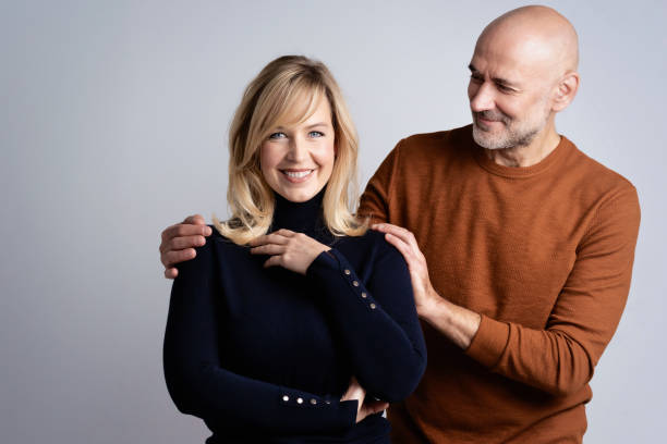 istock Happy mature couple studio portrait 1393547717