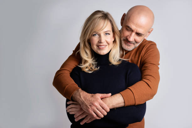 istock Happy mature couple studio portrait 1393547733