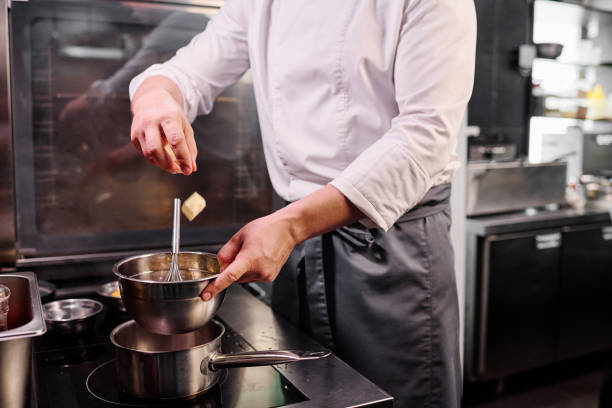 istock Chef melting butter on cooker 1393547740