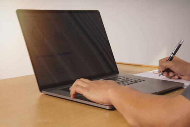 istock Businesspeople use office notebook programs to plan, report and analyze their organization's revenue expenses and growth. The concept of technology in economic and financial collaborative analysis. 1393548010