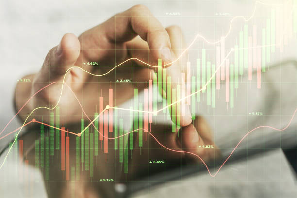 istock Abstract creative financial graph with finger clicks on a digital tablet on background, financial and trading concept. Multiexposure 1393548701