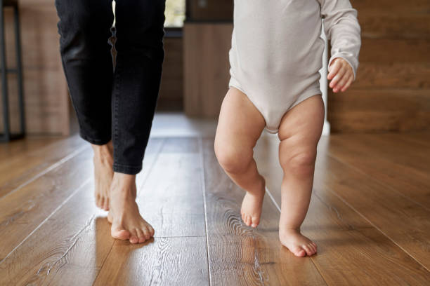 istock First steps of little girl at home interior 1393549131