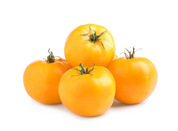 istock Fresh ripe yellow tomatoes on white background 1393550683