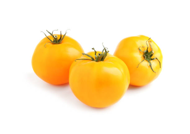 istock Fresh ripe yellow tomatoes on white background 1393550806