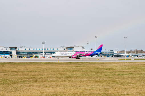 Airbus A320 of Wizzair airlines taxiing towards terminals in Gdansk Lech Wałęsa international airport.