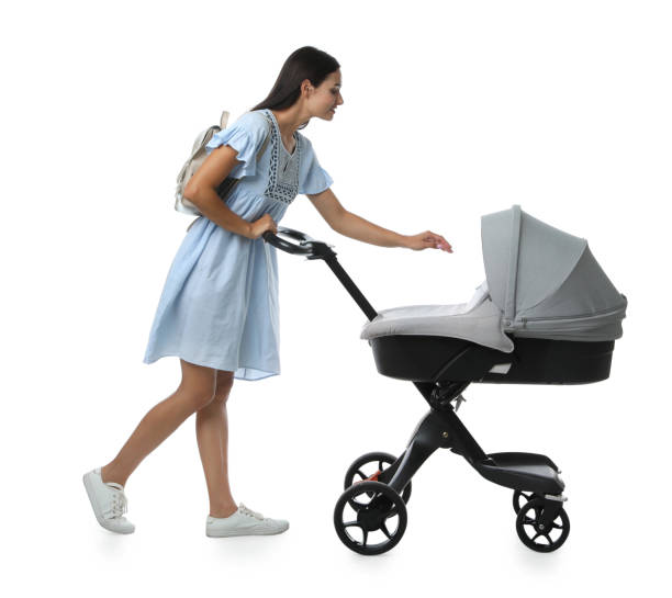 istock Happy young woman with baby stroller on white background 1393551067