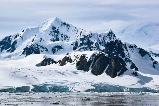 snow and ice covered mountains and glacier in Antarcica