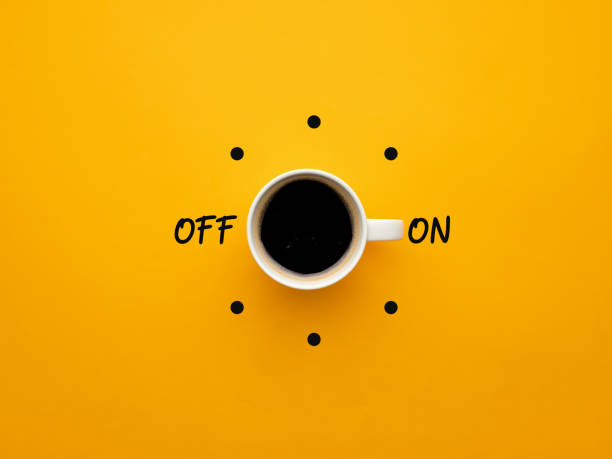 istock Coffee cup switch on off concept on yellow background. Morning wake up coffee break concept. 1393553349