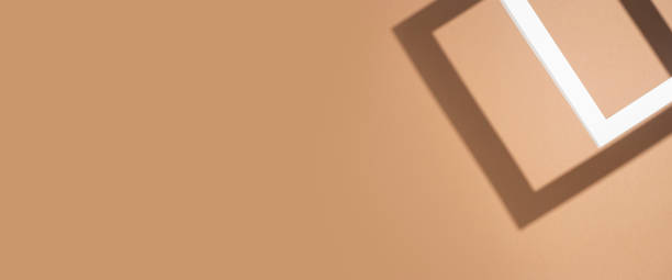 istock White presentation podium frame on brown background. Top view, flat lay. Banner 1393556069