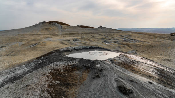istock Mud volcano in mountains. Amazing natural phenomenon 1393556545
