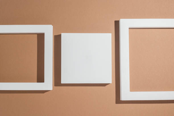 istock White square podiums for presentations on a brown background. Top view, flat lay 1393557243