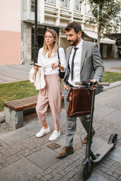 istock Business people with electric scooter 1393557662