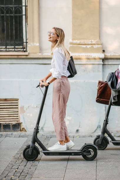 istock Businesswoman on a electric scooter 1393558026