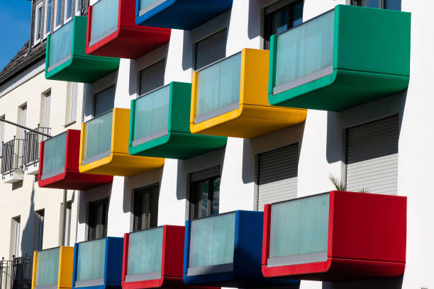 istock Facade of a residential building with multi colored balconies. 1393566083