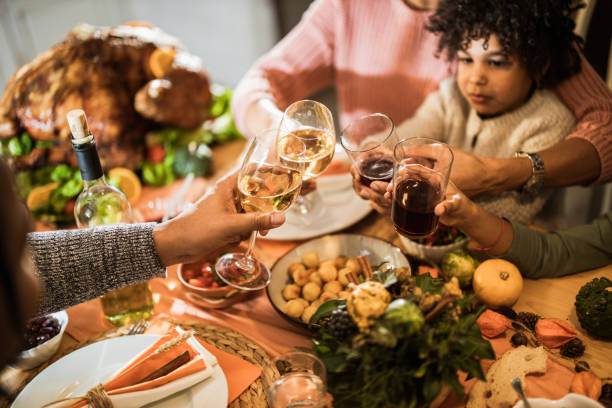 istock Toasting during Thanksgiving meal at dining table! 1393566768
