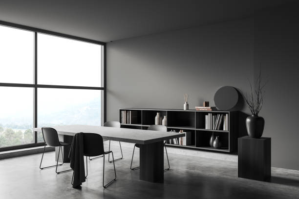 istock Grey meeting room interior with table and seats, shelf and panoramic window 1393568388