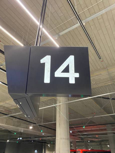 istock Number 14 on a black sign in a bus station 1393568400