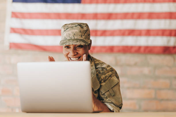 istock Courageous servicewoman video calling her family on a laptop 1393568949