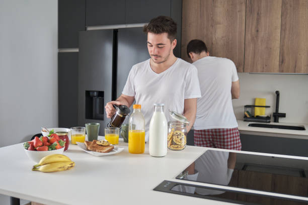 istock Man pouring coffee in a cup. 1393569016
