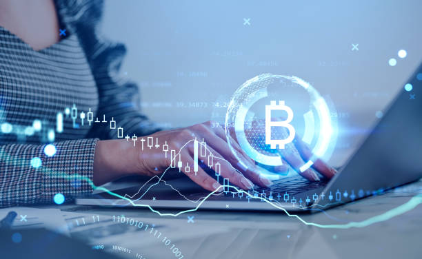 istock Businesswoman working with computer, bitcoin hologram, binary with candlesticks 1393569034