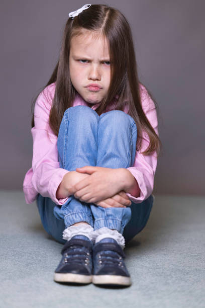 istock Pretty 7-year-old wearing a pink jacket 1393569593