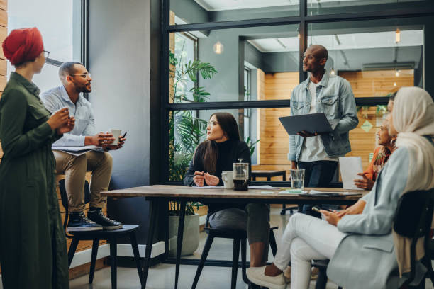 istock Multicultural business professionals having a meeting in an office 1393570178